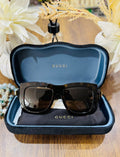 MAY Kaya Gucci black oversized square sunglasses in blue case