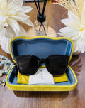MAY Kaya Gucci black square sunglasses in yellow/blue case