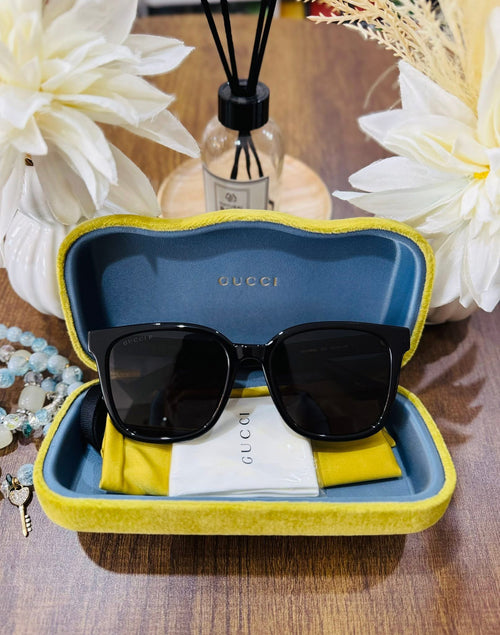 MAY Kaya Gucci black square sunglasses in yellow/blue case