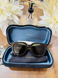 MAY Kaya Gucci black rectangular sunglasses with green detail